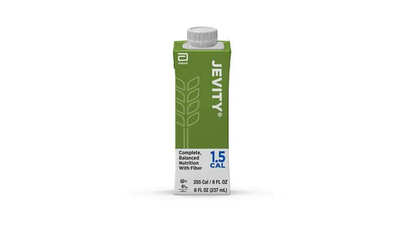A green and white 8 fl oz (237 mL) carton of Jevity 1.5 Cal complete, balanced nutrition with fiber. The carton has a screw cap and Abbott branding.